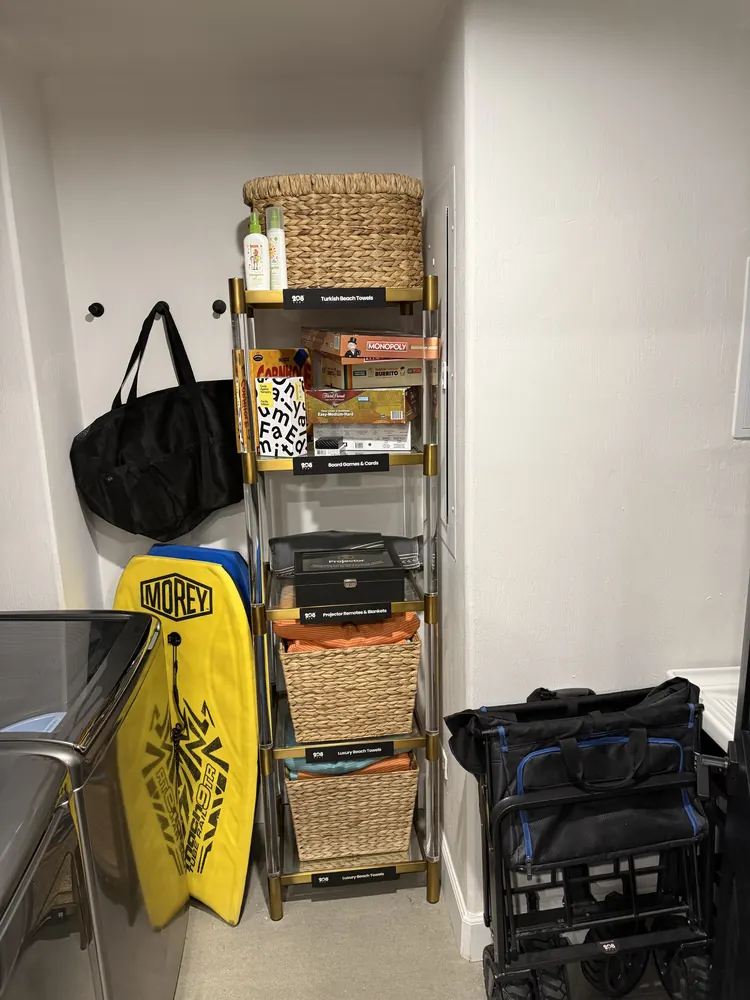 Closet stocked with bodyboards, board games and beach gear