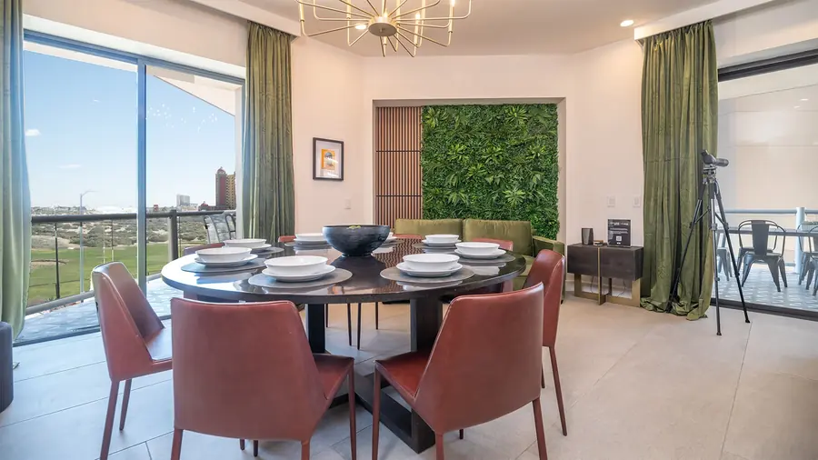 Dining room with round table for eight and living green wall