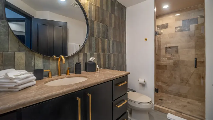 Remodeled guest bathroom with walk-in shower
