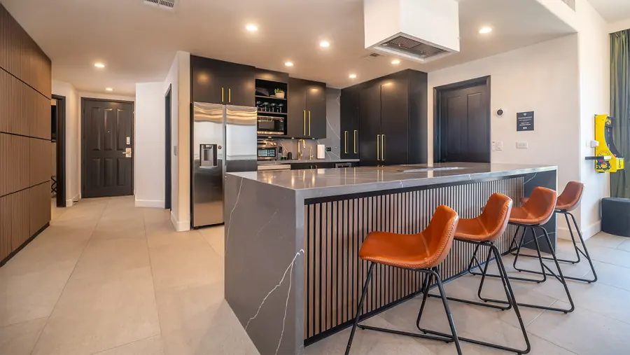 Rubi 208 kitchen with 10-foot island and leather bar stools