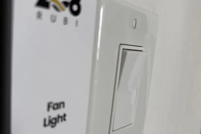 Labeled fan and light switch at Rubi 208