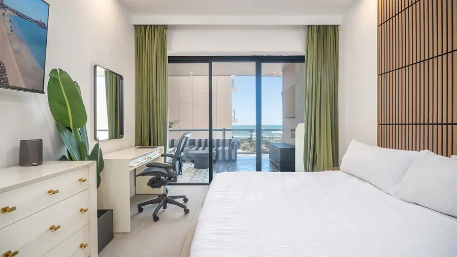 Master Suite A with king bed and patio access at Rubi 208