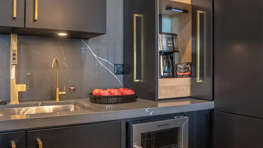 Mini bar with sink and coffee maker in Master Suite B