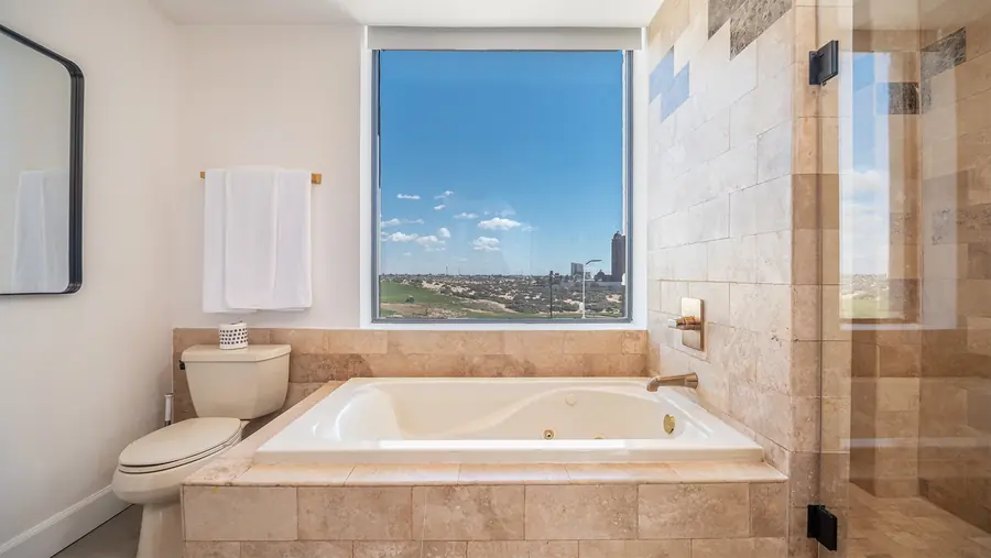 Jacuzzi bathtub with window view in Master Suite B