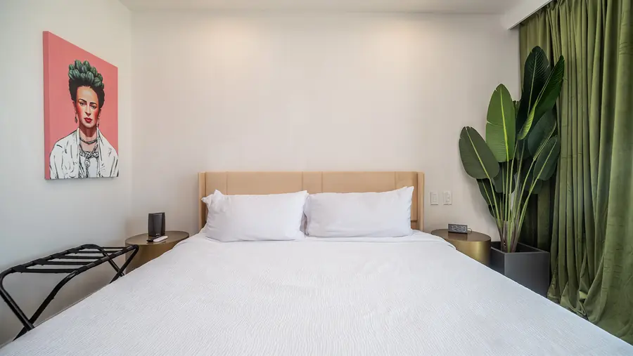 Master Suite B king bed with framed artwork