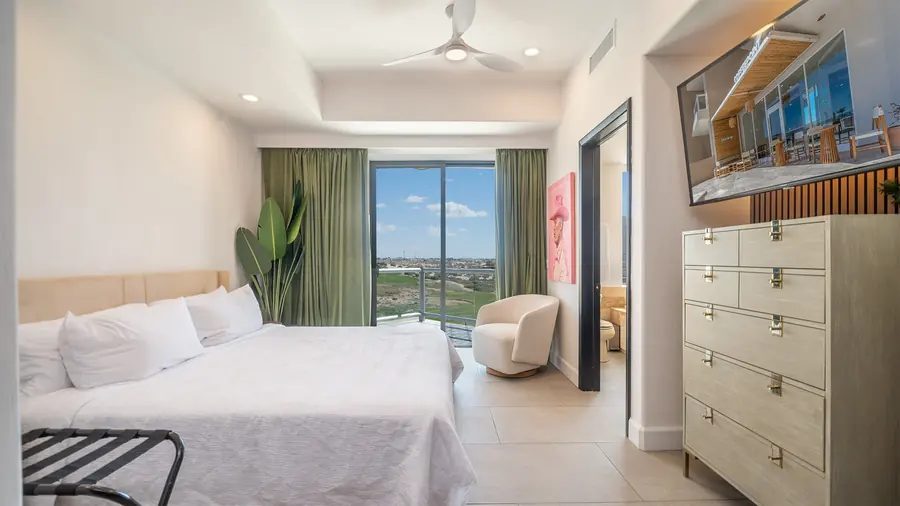 Master Suite B bedroom with dresser and TV