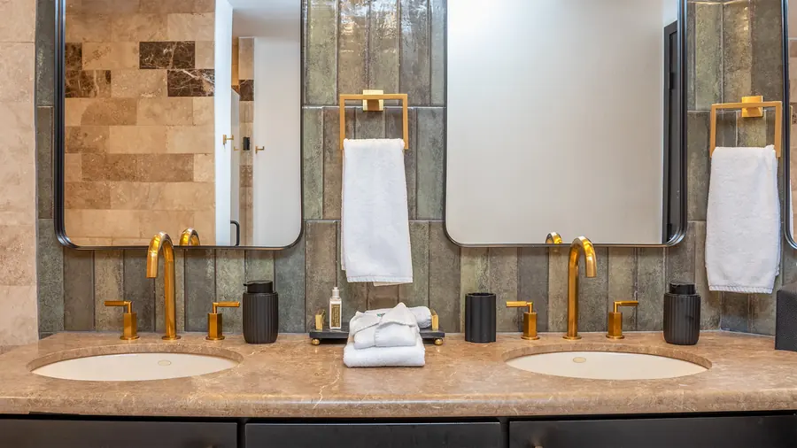 Gold and black dual vanity in the master bathroom