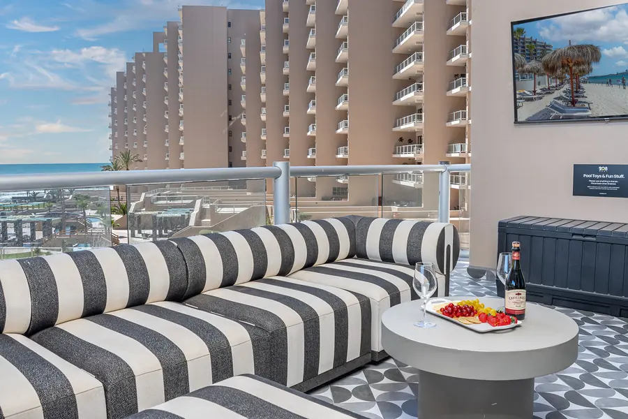 Patio with striped outdoor sofas at Rubi 208