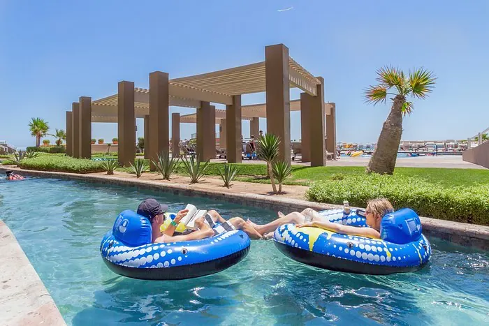 Guests relaxing on floats in the Las Palomas lazy river