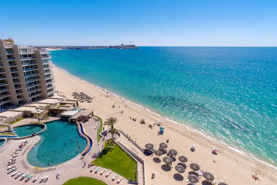 Aerial view of Las Palomas Beach & Golf Resort pools and Sandy Beach in Rocky Point