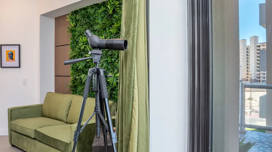 Telescope for dolphin watching by the window
