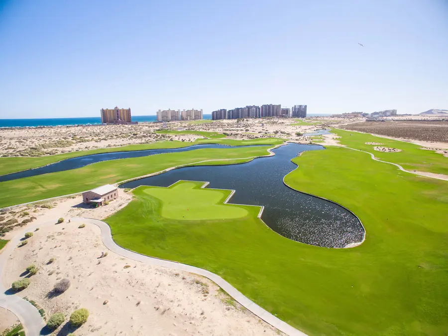The Links at Las Palomas golf course with condo towers behind